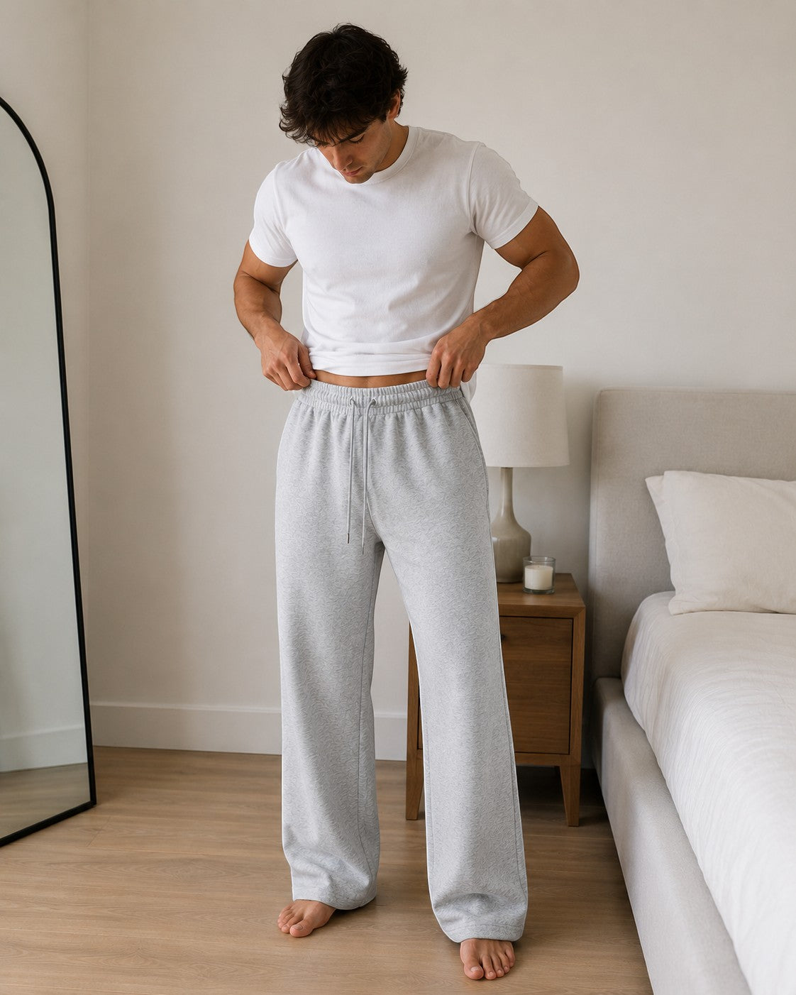 Rise With Purpose heather grey relaxed fit wide leg sweatpants with drawstring waist and side pockets worn by a man.