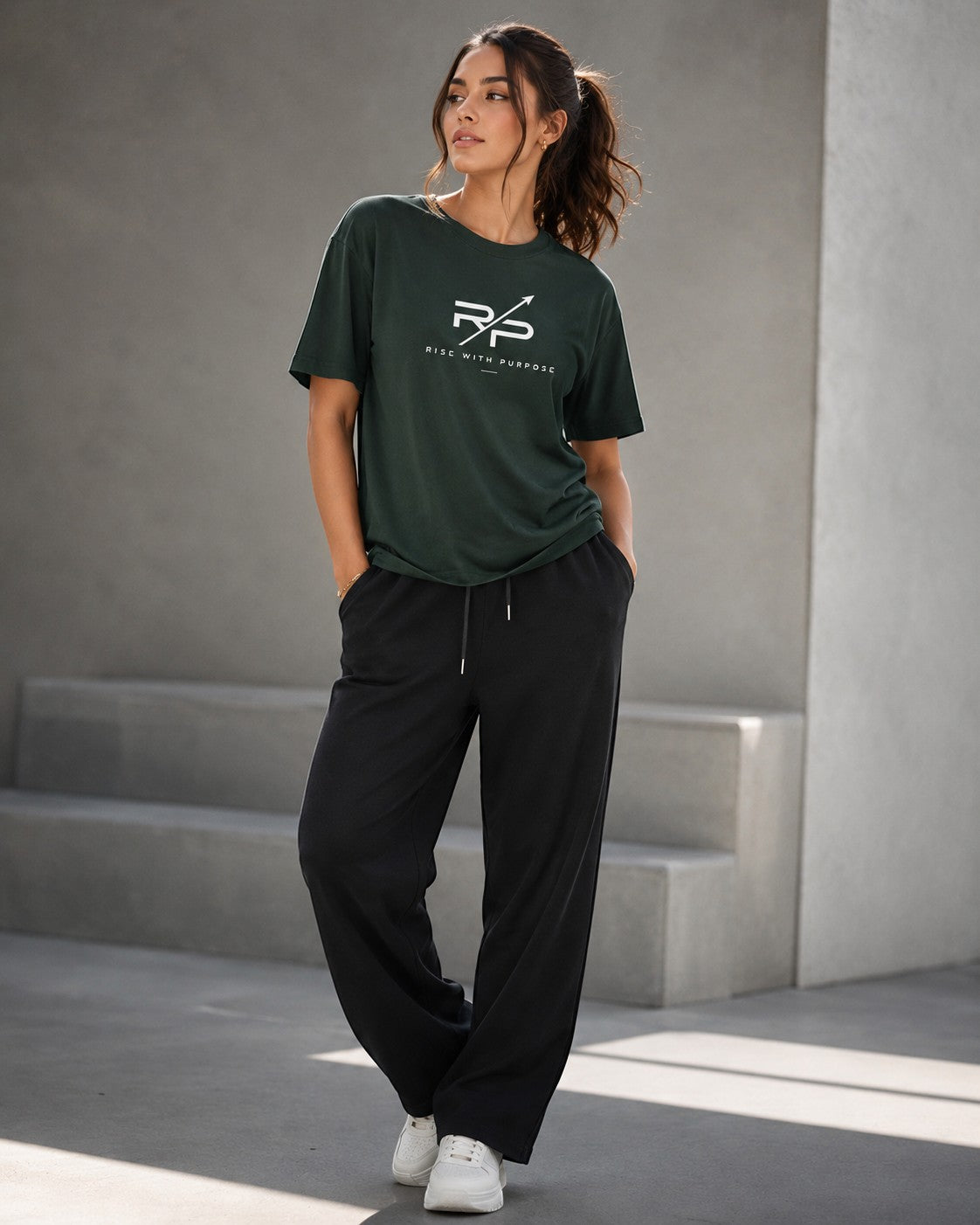 Rise With Purpose dark green Sorona t-shirt with crew neck and short sleeves, featuring a white logo graphic on the chest.